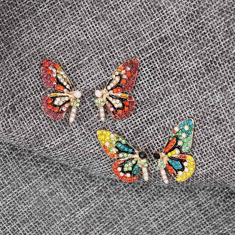 Pendientes de alas de mariposa aretes de Metal